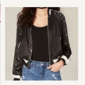 Black and white Bebe star bomber jacket